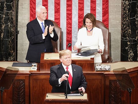 President Donald Trump, with Speaker Nancy Pelosi and Vice President Mike Pence looking on, delivers the State of the Union.