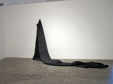 Sara Al Haddad. as you try to forget me (2015), yarn, metal rings and cardbaord