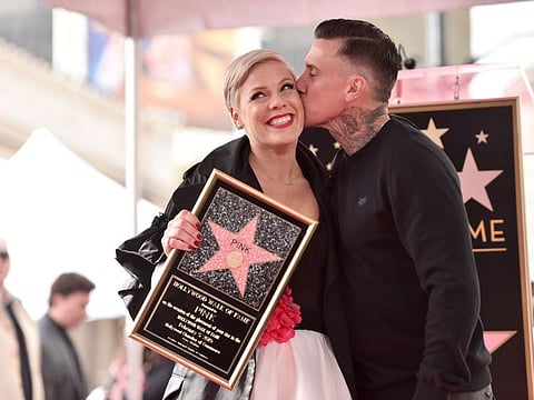 Pink and Carey Hart attend a ceremony honoring her with the 2.656th star on The Hollywood Walk Of Fame on February 05, 2019 in Hollywood, California.