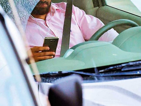There appears to be a growing number of people using their phones for calling and texting while driving on UAE roads. Even smoking and eating in cars has become quite common.