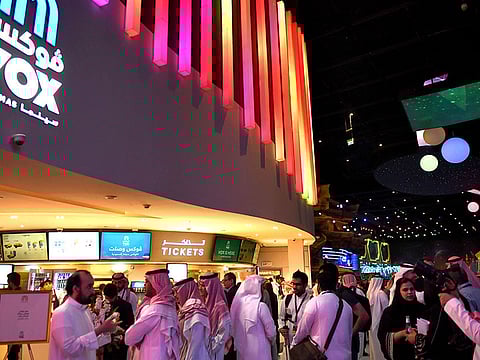 Saudis gather at a cinema theatre in Riyadh Park mall after its opening for the general public in Riyadh.