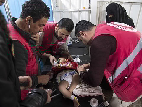 Syrian medics treat a baby at a makeshift clinic at the Internally Displaced Persons (IDP) camp of Al Hol in Hasakeh governorate in northeastern Syria on February 6.
