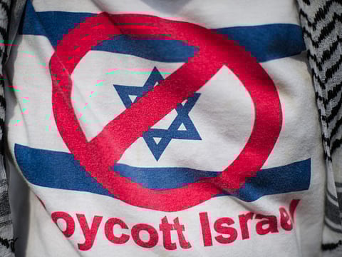 File photo: A supporter wears a T-shirt reading 'Boycott Israel' at the Palestinian embassy in Kuala Lumpur, during a rally against Israeli air strikes on Gaza.