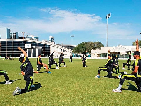 Lahore Qalandars players warm up during a training session at the ICC Cricket Academy.