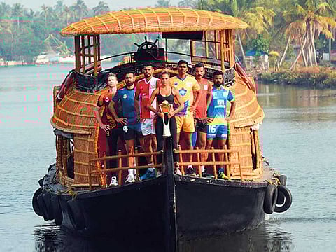 The captains of the six frachises pose on a boat house in Kochi. Kochi will host the first 12 matches.