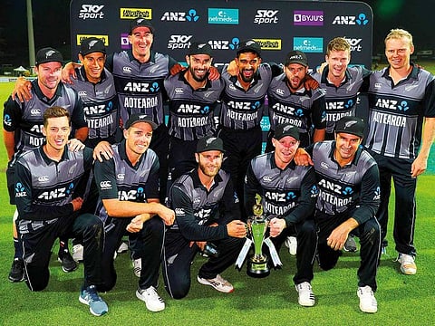 New Zealand pose with the trophy after winning the Twenty20 series at the Seddon Park in Hamilton yesterday. The hosts took the series 2-1 after a close four-run victory over India in the final match.