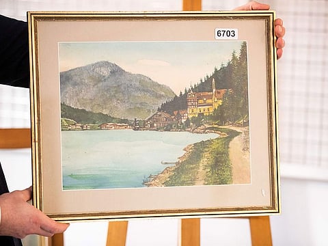 A picture taken on February 8, 2019 shows the watercolour entitled "Ortschaft an Vorgebirgssee", a scene of a village near a mountain lake, signed "A. Hitler", which is on display at the Weidler auction house in the southern city of Nuremberg.