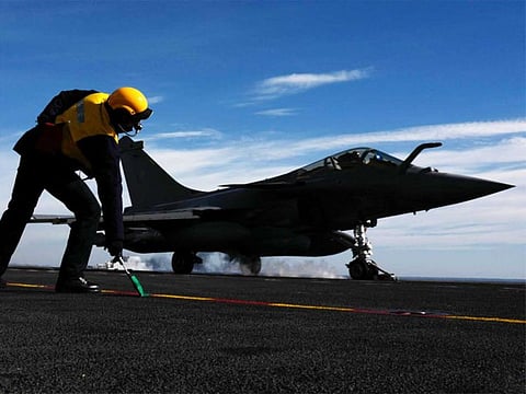 A French Rafale fighter jet takes off from the "Charles de Gaulle" aircraft carrier in the Mediterranean sea