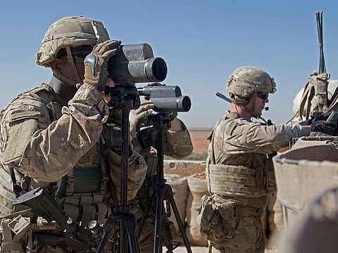 U.S. Soldiers surveil the area during a combined joint patrol in Manbij, Syria