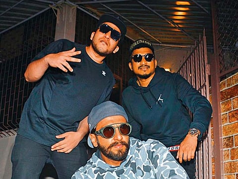 Actor Ranveer Singh (centre) with rappers Divine and Naezy.