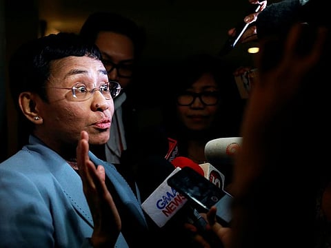 A file photo of Maria Ressa, an executive of online news platform Rappler, speaking to the media after being served an arrest warrant in Rappler's office in Pasig City, Philippines February, 13 2019.