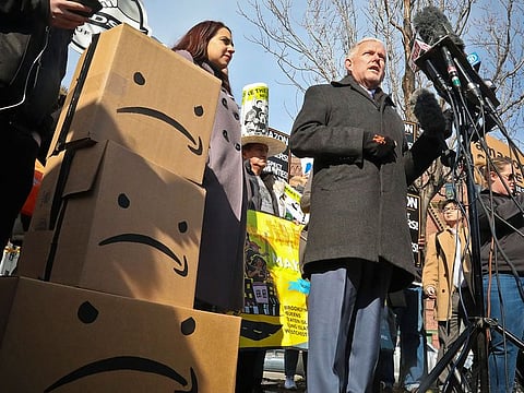 New York City Councilman Jimmy Van Bramer, center, speaks during a conference in Gordon Triangle Park in the Queens borough of New York, following Amazon's announcement it would abandon its proposed headquarters for the area, Thursday Feb. 14, 2019.