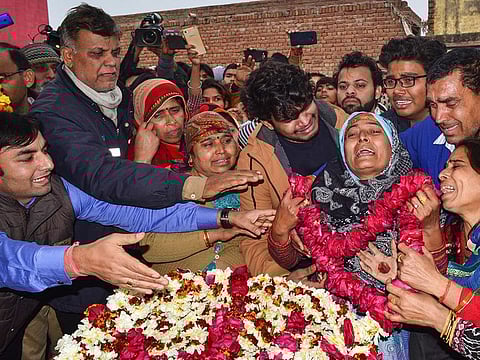 Family members of slain CRPF Jawan Kaushal Kumar Rawat pay their last respects before his funeral procession, in Agra, Saturday, Feb. 16, 2019. Rawat lost his life in Pulwama terror attack.