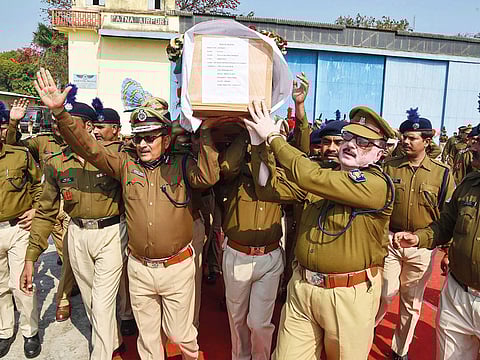 DGP Gupteshwar Pandey shoulders the coffin of slain CRPF jawan Ratan Thakur. Pandey has quit his post to try his hand in the upcoming elections.