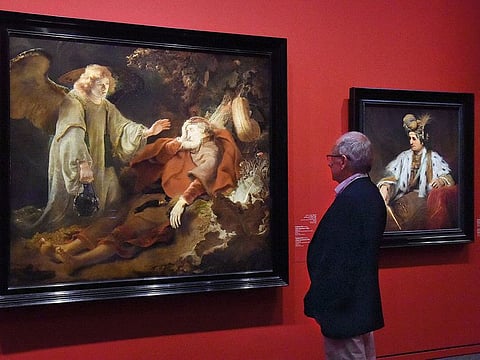 A visitor admiring an artwork from the collection of Dutch Golden Age’s Exhibition at the Louvre Abu Dhabi.