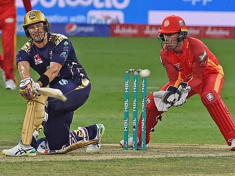 Quetta Gladiators’ Shane Watson sweeps a shot during his unbeaten half century against Islamabad United.