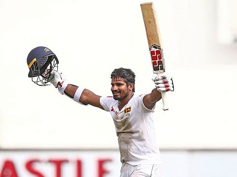 Sri Lanka's Kusal Perera celebrates the victory after hittting the winning runs during the fourth day of the first Cricket Test between South Africa and Sri Lanka at the Kingsmead Stadium in Durban on February 16, 2019.