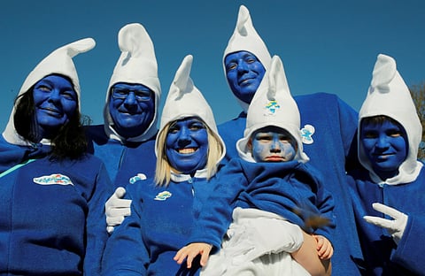 Participants dressed as smurfs pose during an attempt to hold the world's largest meeting of smurfs in a bid to outdo the previous record of 2,510 mostly student participants in Wales in 2009 in Lauchringen, Germany February 16, 2019.
