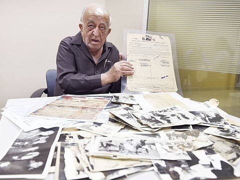 M.S. Faruk shows his collection of rare photographs and documents. Among his possessions is an 1879 stamped envelope addressed to the Ruler of Sharjah.