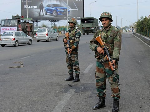 Indian army soldiers keep vigil during the fourth consecutive day of curfew in Jammu, the winter capital of Jammu and Kashmir state, India, Monday, Feb.18, 2019.