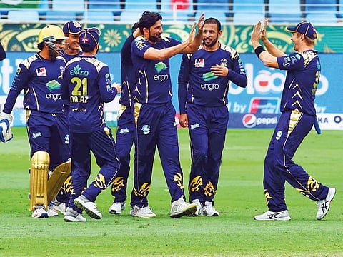 Quetta Gladiators celebrate their victory over Islamabad United during a PSL match at the Dubai International Stadium.