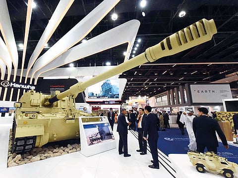 Visitors look at South Korean Hanwha Land Systems’ K9 Thunder 155 mm/52 calibre self-propelled howitzer at the company’s pavilion during IDEX 2019 on Tuesday.