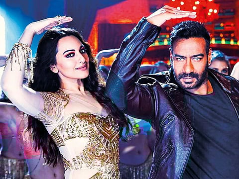 Sonakshi Sinha with Devgn.