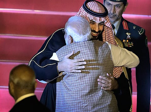 Saudi Crown Prince Mohammad Bin Salman (L) and India's Prime Minister Narendra Modi (R) embrace during a cermonial reception at the presidential palace in New Delhi on February 20, 2019.