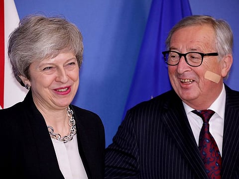 British Prime Minister Theresa May, left, is greeted by European Commission President Jean-Claude Juncker prior to a meeting at EU headquarters in Brussels, Wednesday, Feb. 20, 2019.