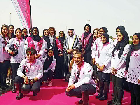 Dr Shaikh Sultan with medical and community volunteers during the launch of the ninth edition of the Pink Caravan at Sharjah Equestrian and Racing Club on Saturday.