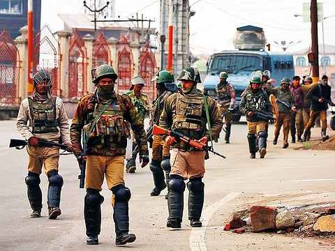 Indian Central Reserve Police Force (CRPF) personnel patrol a street in downtown Srinagar on Saturday.
