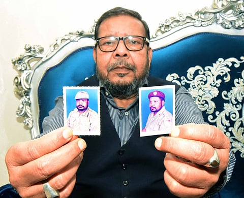Indian expatriate Saeed Peter, who served in the UAE Armed Forces between 1988 and 1990, shows pictures from his time in the military.
