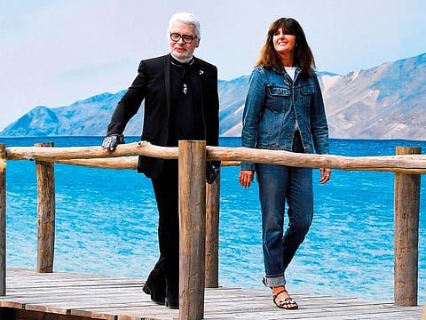 Karl Lagerfeld and Virginie Viard acknowledge the audience at the end of the Chanel springsummer 2019 show in October 2018.