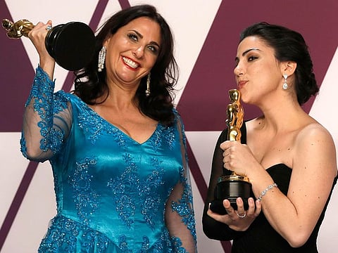 Rayka Zehtabchi and Melissa Berton with their award for Best Documentary Short Subject award for the film "Period. End Of Sentence.