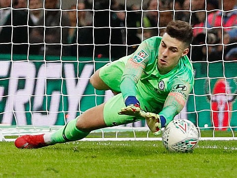 Chelsea's Spanish goalkeeper Kepa Arrizabalaga fails to stop the ball from Manchester City's Argentinian striker Sergio Aguero in the penalty shoot out at the end of the English League Cup final football at Wembley stadium in north London on February 24, 2019.
