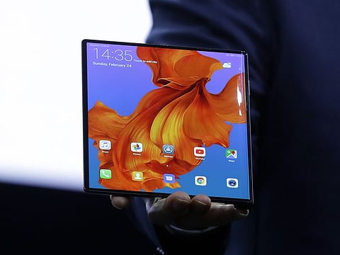 Huawei CEO Richard Yu displays the new Huawei Mate X foldable 5G smartphone at the Mobile World Congress, in Barcelona, Spain, Sunday, Feb. 24, 2019