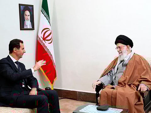 Syrian President Bashar Assad, left, speaks with Iranian Supreme Leader Ayatollah Ali Khamenei during their meeting in Tehran