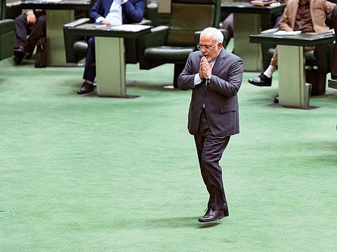 In this Oct. 2, 2016, file photo, Iranian Foreign Minister Mohammad Javad Zarif walks to the podium to answer questions from lawmakers in an open session of parliament in Tehran, Iran.
