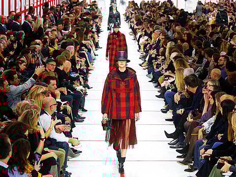 Models present creations by designer Maria Grazia Chiuri as part of her Fall/Winter 2019-2020 women's ready-to-wear collection show for fashion house Dior during Paris Fashion Week in Paris