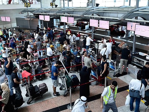 Passengers at check in counters at Sharjah International airport. (Image is for illustration purposes only.)