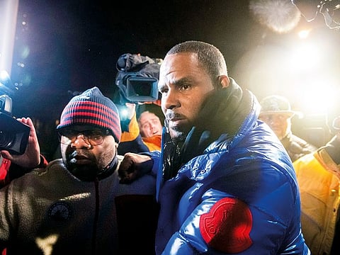 R Kelly surrenders to authorities at Chicago First District police station, on February 22.
