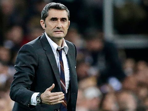 Barcelona coach Ernesto Valverde gives instructions to his players during the Spanish La Liga soccer match between Real Madrid and FC Barcelona at the Bernabeu stadium in Madrid, Saturday, March 2, 2019.