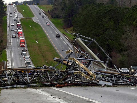 A fallen cell tower lies across U.S. Route 280 highway in Lee County, Alabama, in the Smiths Station community after what appeared to be a tornado struck in the area Sunday, March 3, 2019.