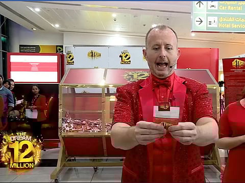 The host of the Big Ticket draw in Abu Dhabi announces one of the winners.