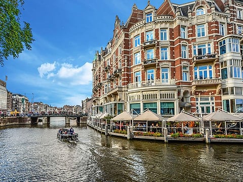Houses over river Amstel in Amsterdam, Netherlands