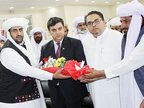 Pakistani Consul General Ahmed Amjad Ali is welcomed by Omar Baloch and Chaudhry Khalid Hussain at the Baloch Cultural Day in Sharjah