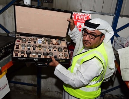Ebrahim Behzad displays a batch of fake luxury watches confiscated in 2017. Shoes, bags, cosmetics, smartphones and accessories were the most common fake products seized.