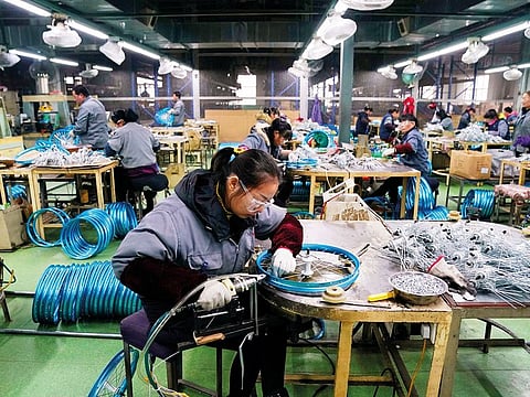 A bicycle production line in Kunshan, China. The OECD believes a sharper slowdown in China would have ‘significant adverse consequences for global growth and trade.’