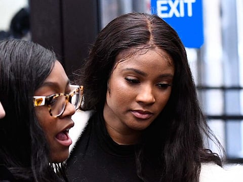 In this Feb. 23, 2019, photo, Azriel Clary, left, 21, and Joycelyn Savage, 23, leave the the Leighton Criminal Courthouse in Chicago following R&B star R. Kelly's first court appearance on sexual abuse charges.