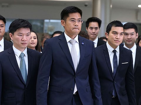 eader of Thai Raksa Chart party Preechapol Pongpanich, center, leaves the Constitutional Court in Bangkok, Thailand.